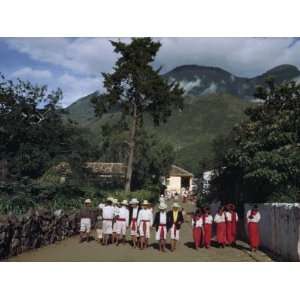  Group of Women Ignores a Group of Men on a Road During a 