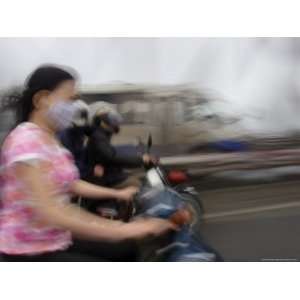 Traffic Speeds Through Hanoi, Vietnam, Indochina, Southeast Asia 