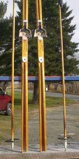 The skis are signed BONNA MODEL 1800. Measures 81 (210 cm) long 