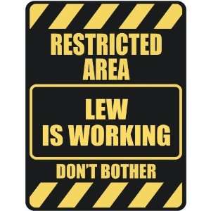   RESTRICTED AREA LEW IS WORKING  PARKING SIGN