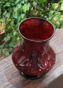 This is a excellent Ruby glass vase A raised flower design Damage free 