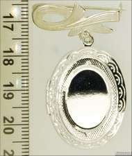 WBM oval engraved locket, white cats eye cabochon  