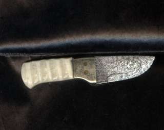 overall length 4 inches damascus dagger with brass guard and bone 