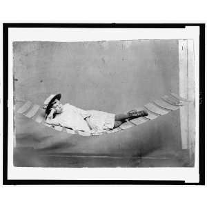   reclining in a hammock,1880 1910,Tintype,wearing hat