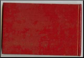 This item is a red leatherette book or binder issued to store the 