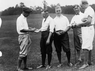1900s Five men in golf attire, holding golf clubs  