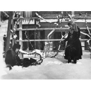  Young Lehman and a Girl Playing with a Sled in Deep Snow 