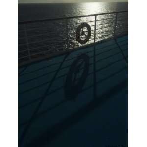  Life Preserver Hanging on a Railing of a Cruise Ship Deck 