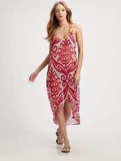 This voluminous, semi sheer style features a bright ikat print and an 