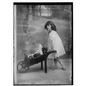  Daughter of Mrs. Marshall Field,pushing doll cart