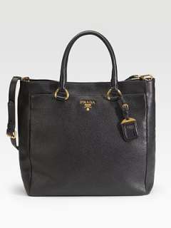  in pebbled calfskin with a removable shoulder strap and luggage tag