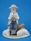 Boy playing a flute to sheep   NAO Figurine by Lladro 1