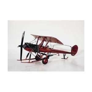  Red single wing plane with skis and wheels Sports 