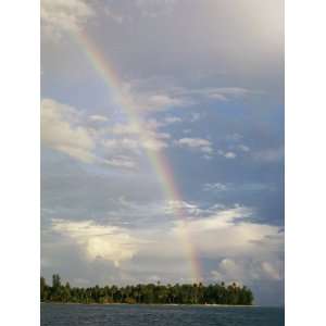  Rainbow in Sky after a Storm over a Palm Tree Studded 