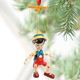 featuring sparkling glitter accents geppetto s little wooden puppet 